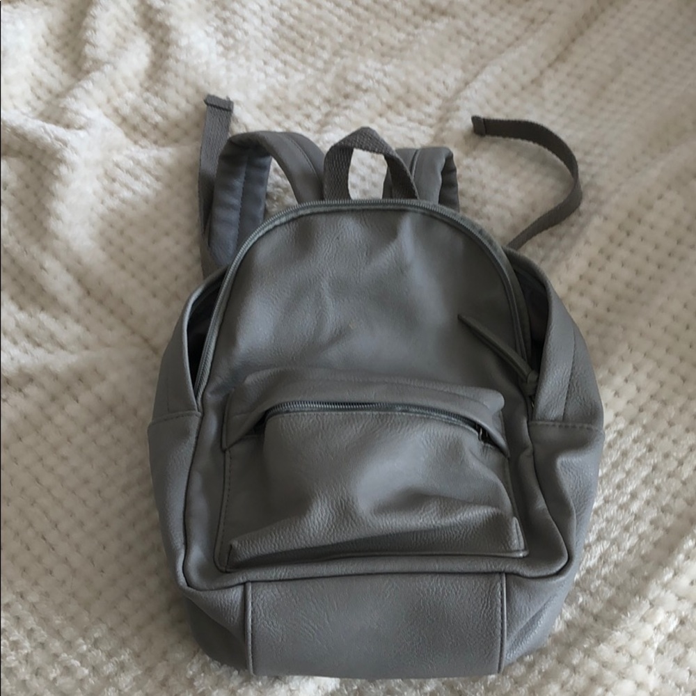 mini grey backpack. fake leather